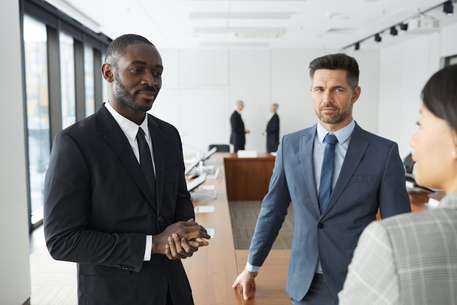 A diverse group of professionals engaged in a business meeting in a modern conference room